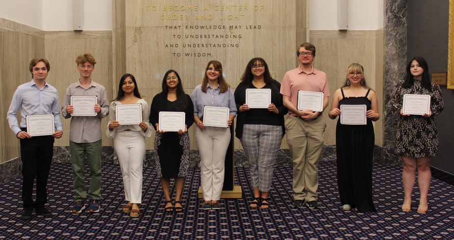 SI Bridges scholars holding certificates from the 2024 symposium