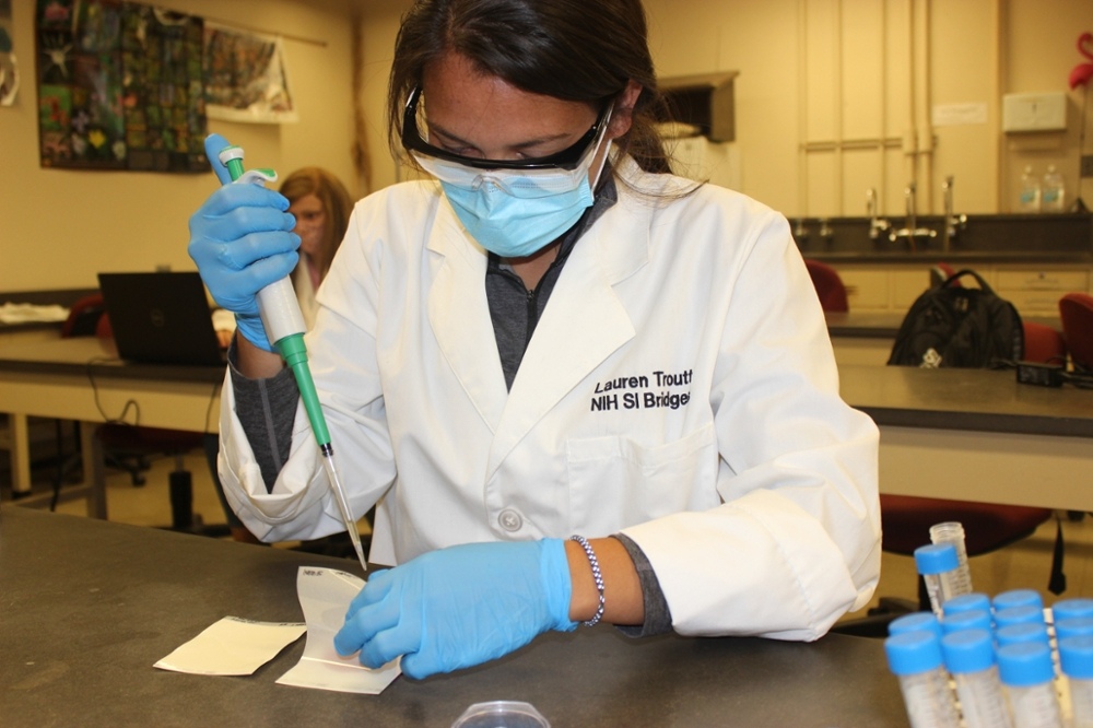 Scholar with testing equipment